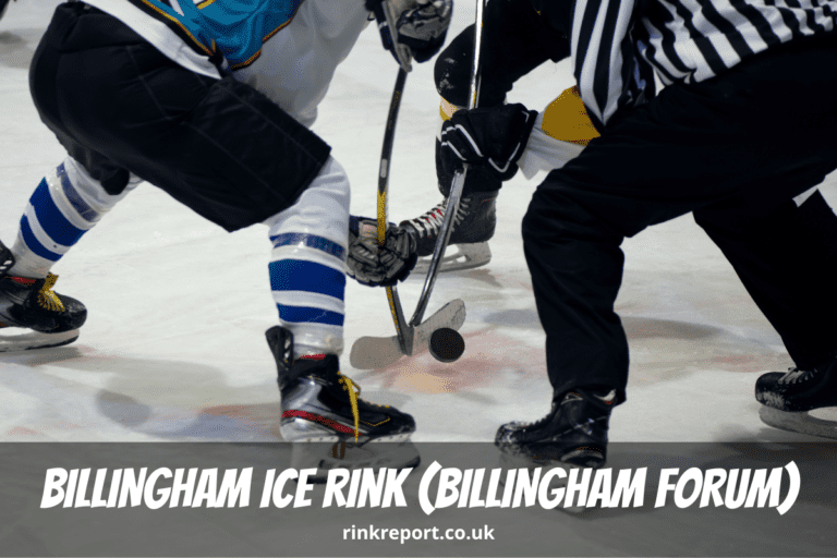 Two ice hockey players face of with a referee at billingham ice rink also known as billingham forum ice arena