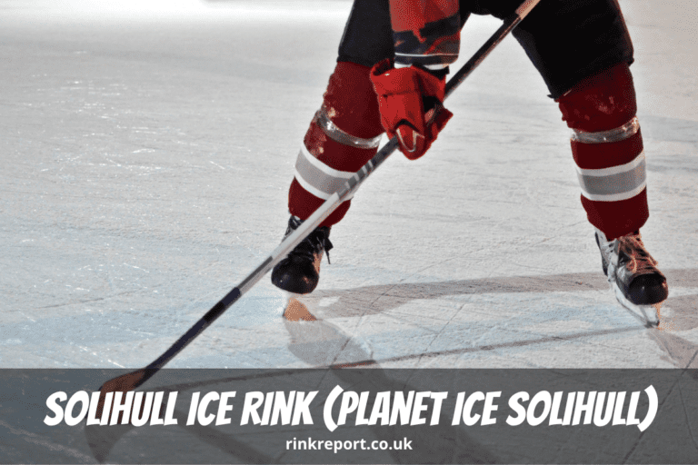An ice hockey player stands on the ice in ice skates and holding a hockey stick at solihull ice rink also known as planet ice solihull