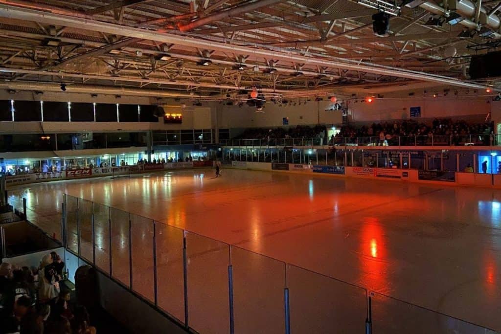 Bright orange lights shine down on guildford ice rink at the spectrum leisure centre before the start of a guildford flames ice hockey game
